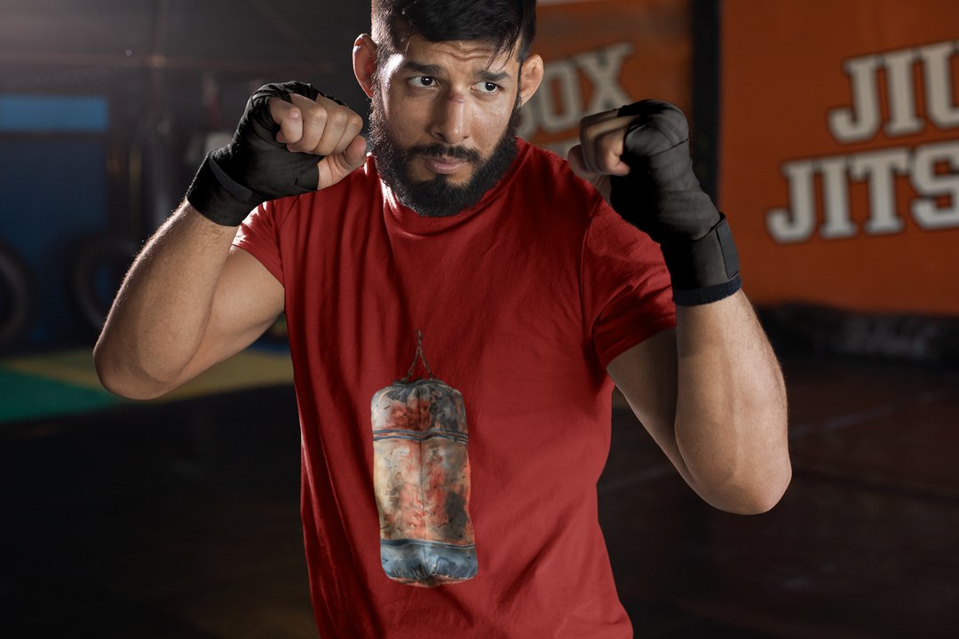 Red Orange Heavy Bag Worn boxing t-shirt in red, sparring shot