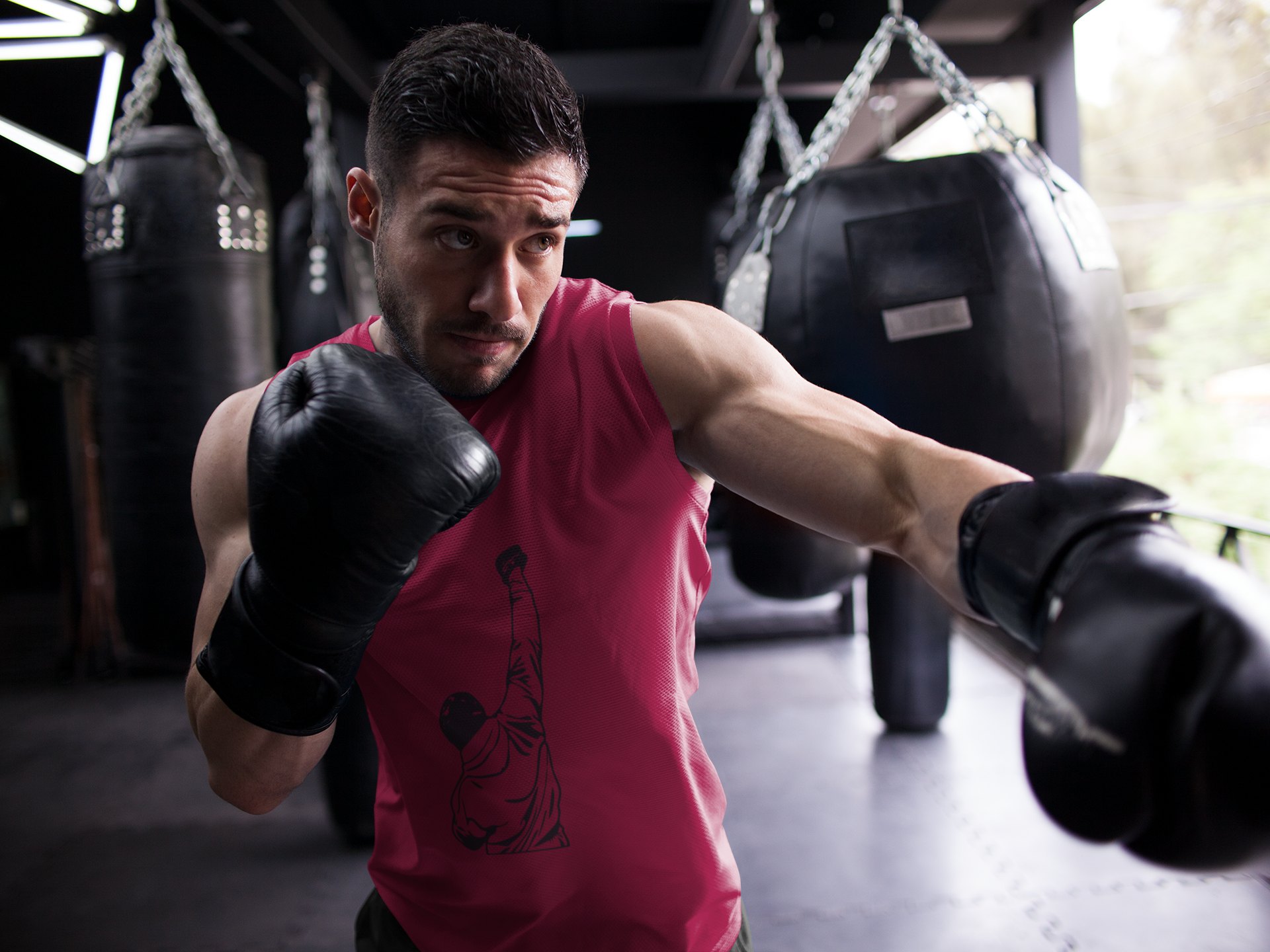 Rocky Muscle Fist Raised boxing vest in burgundy, shadowboxing shot