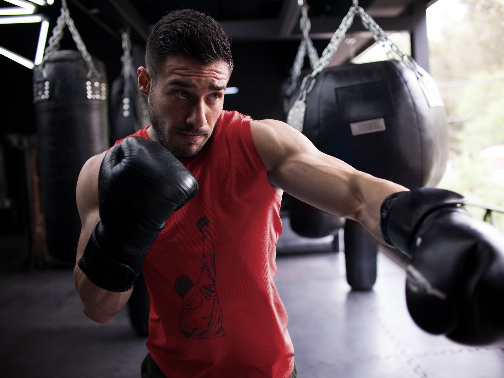 Rocky Muscle Fist Raised boxing vest in red, shadowboxing shot