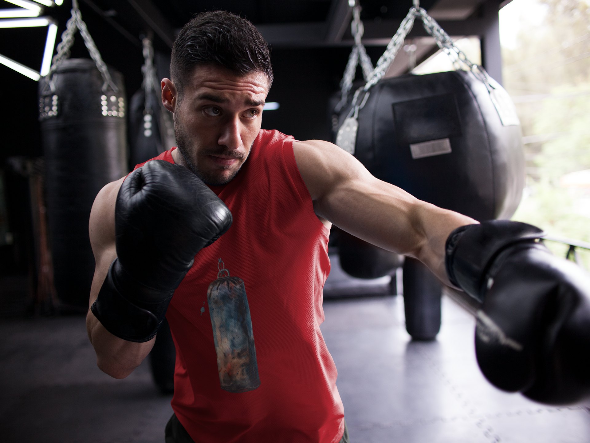 Red Heavy Bag Worn Hanging boxing vest in red, shadowboxing shot