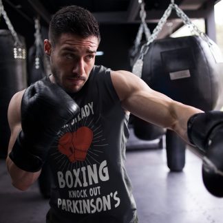 Rock Steady Boxing Parkinsons boxing vest in black, shadowboxing shot