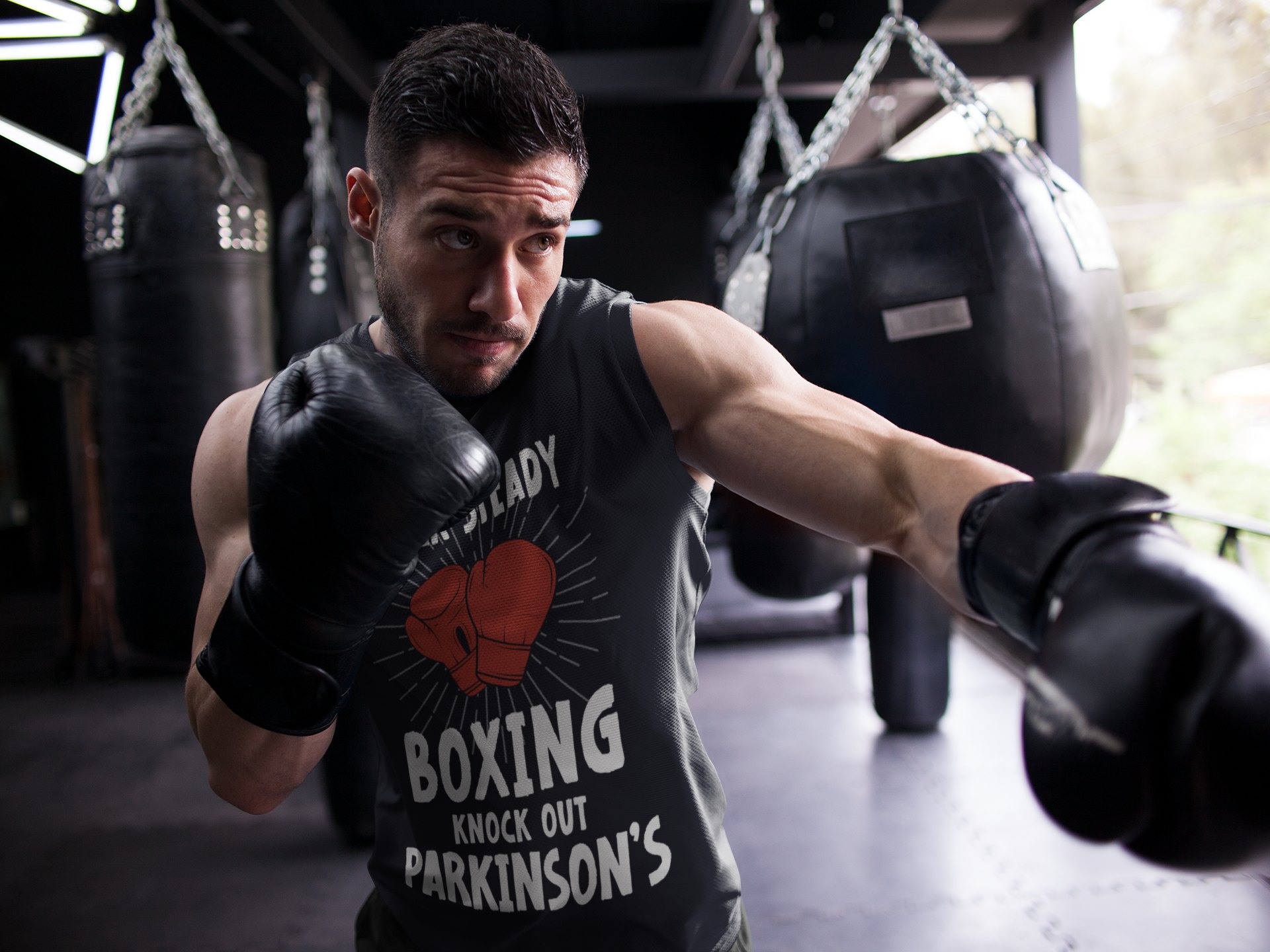 Rock Steady Boxing Parkinsons boxing vest in black, shadowboxing shot