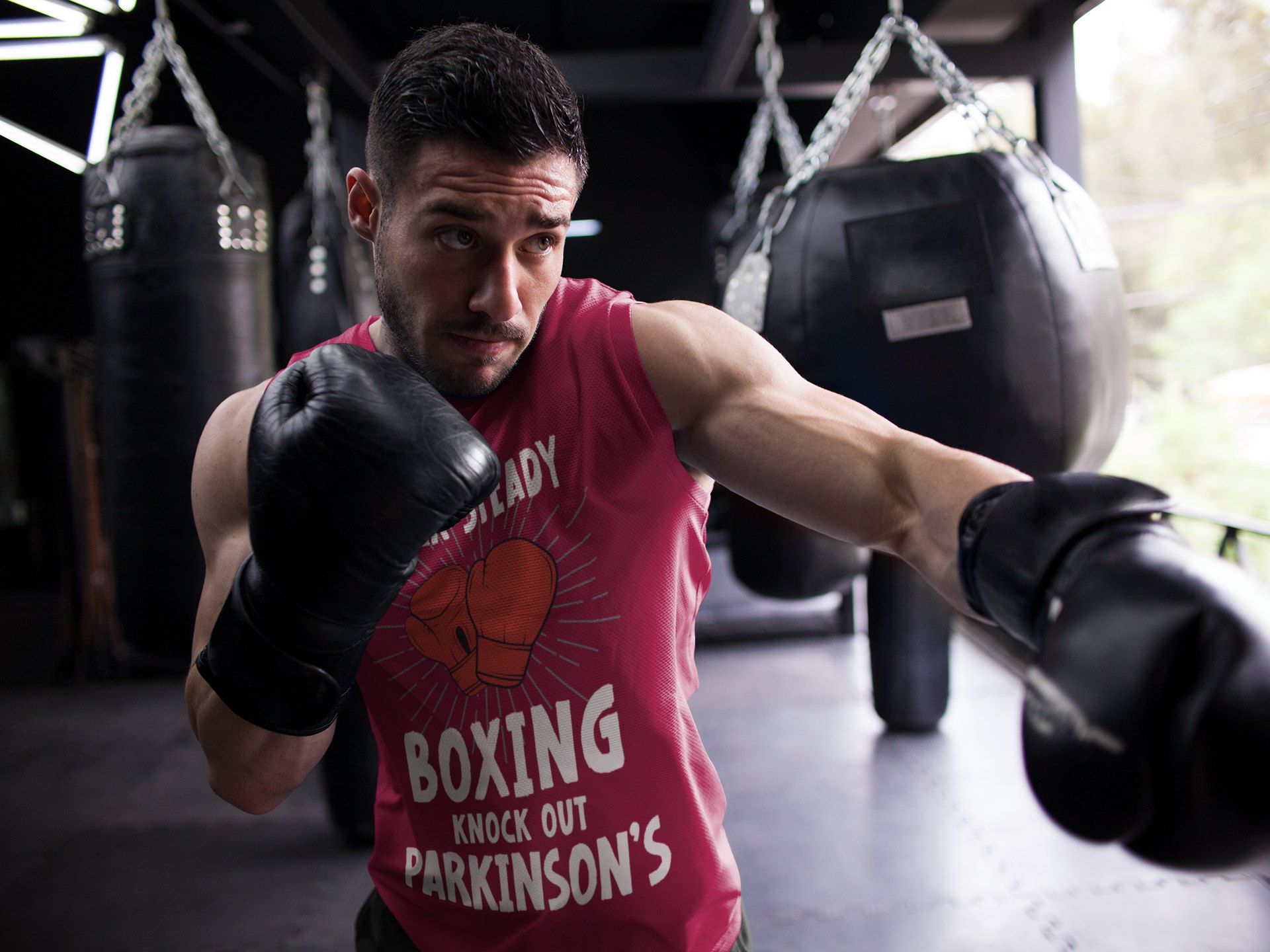 Rock Steady Boxing Parkinsons boxing vest in burgundy, shadowboxing shot