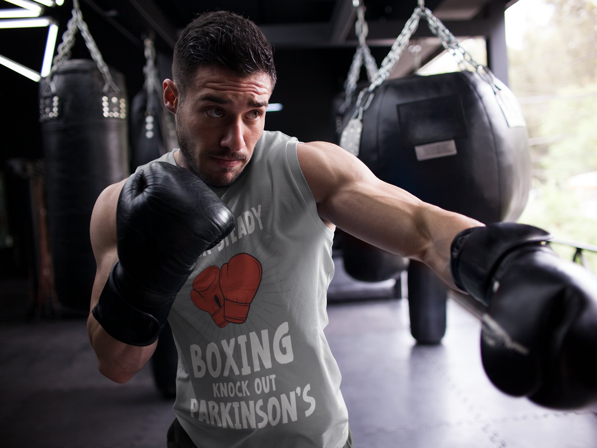 Rock Steady Boxing Parkinsons boxing vest in grey, shadowboxing shot