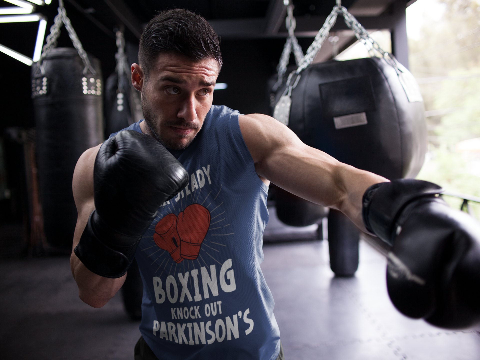 Rock Steady Boxing Parkinsons boxing vest in navy, shadowboxing shot