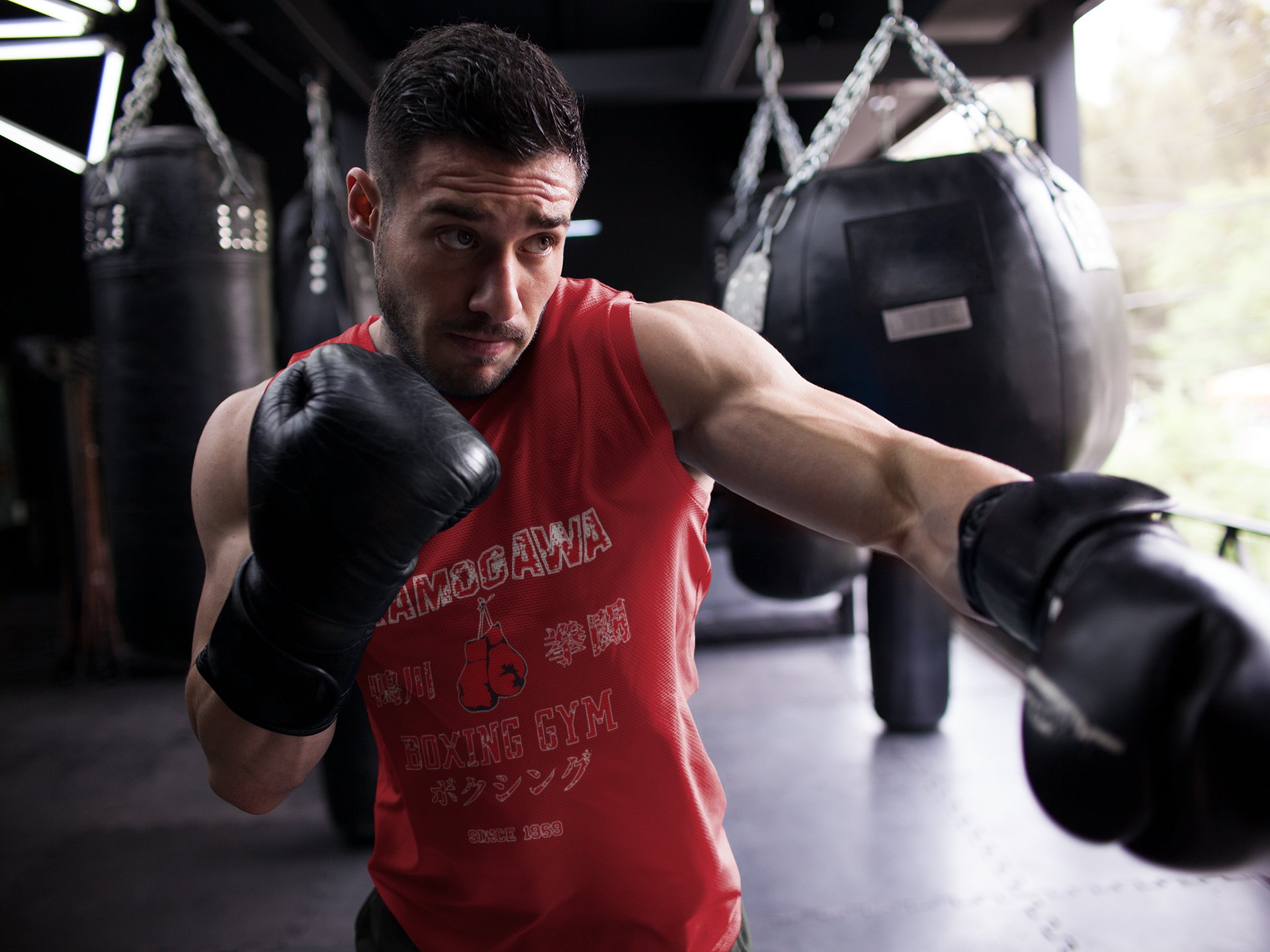 Kamogawa Boxing Gym boxing vest in red, shadowboxing shot